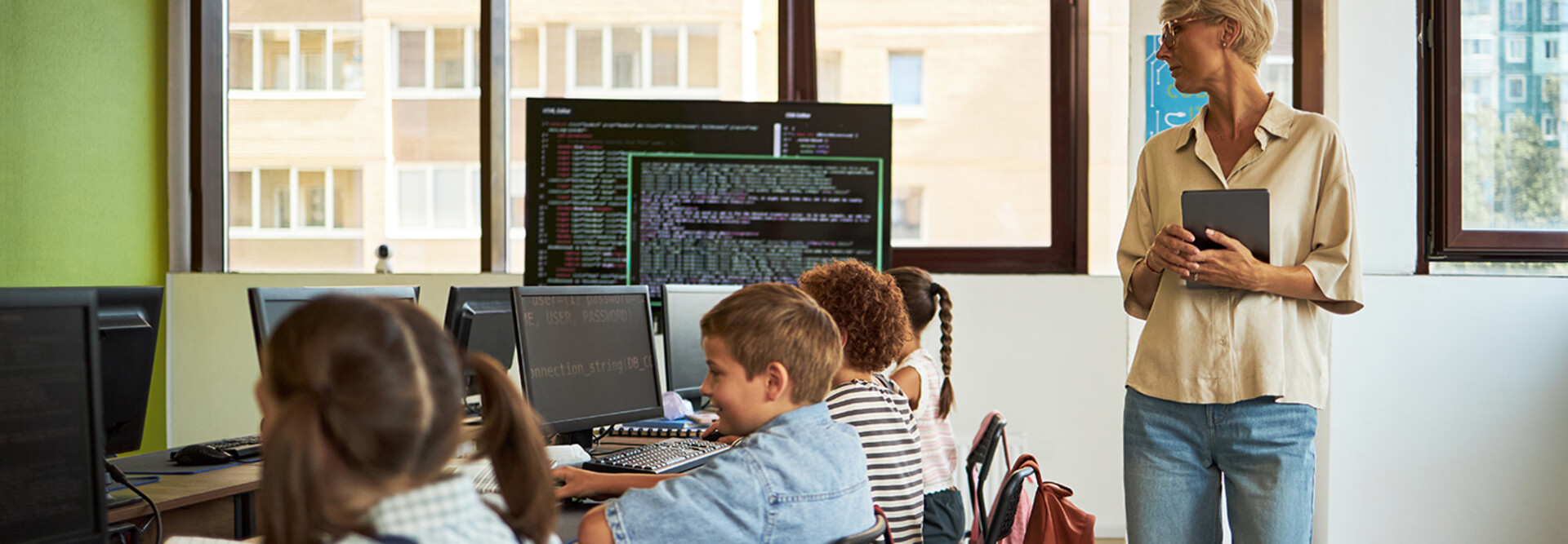 Teacher observing students in a classroom