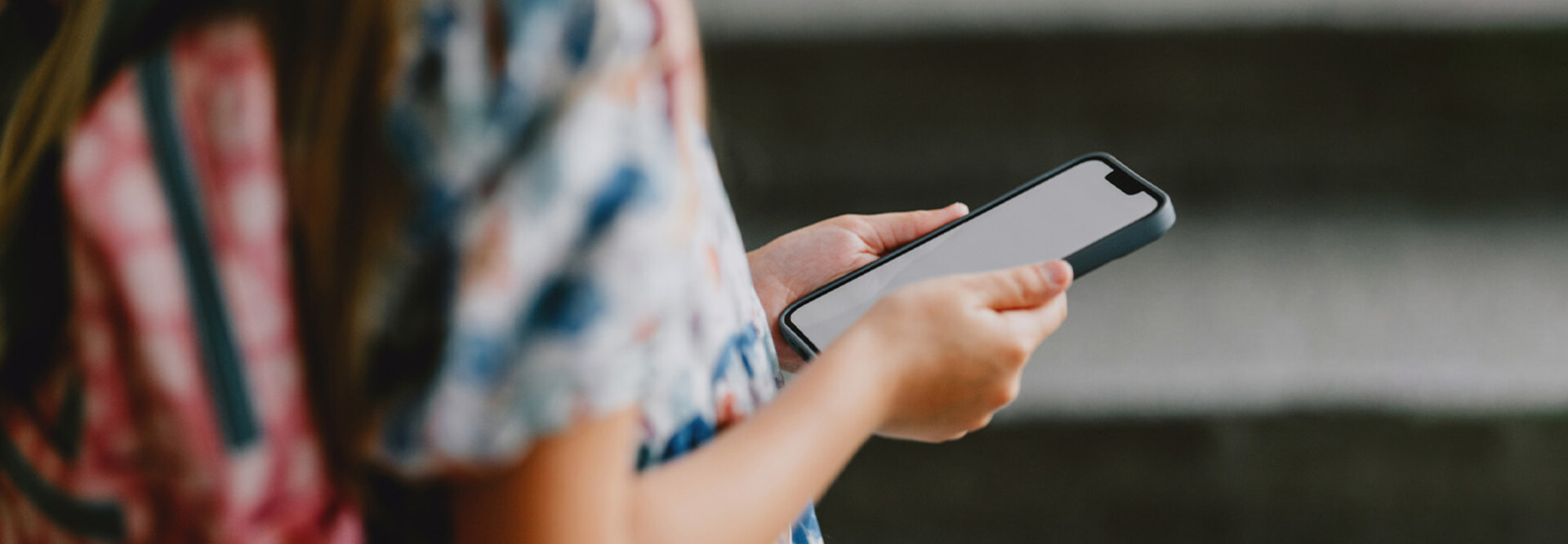 Young student using phone