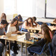 Students working at desks together in a classroom