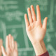 Hands in a classroom