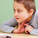 Young boy with special needs using laptop