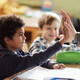 School kids excited in class