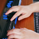 Blind student using braille technology