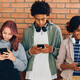Students looking at phones in school