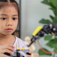 K12 student working on steam project with robot