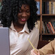 Teacher assisting student in class