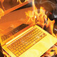 computer generated image of laptop on fire