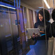 IT leader using a laptop computer next to servers