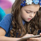 Student using tablet in class