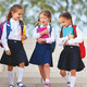 Elementary students walking on school campus