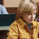 Boy on Laptop in classroom