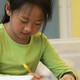 A K-12 student focusing and working on a creative makerspace project