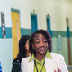 Diverse group of educators walking in hallway