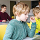 students on laptops in classroom