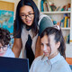 Students using computer in classroom