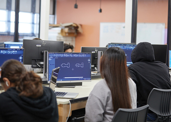 Students designing on computers