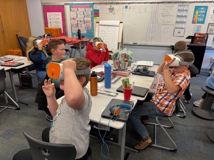 Students using VR headsets