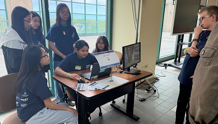 Students from John C. Haines Elementary School present their quantum park.