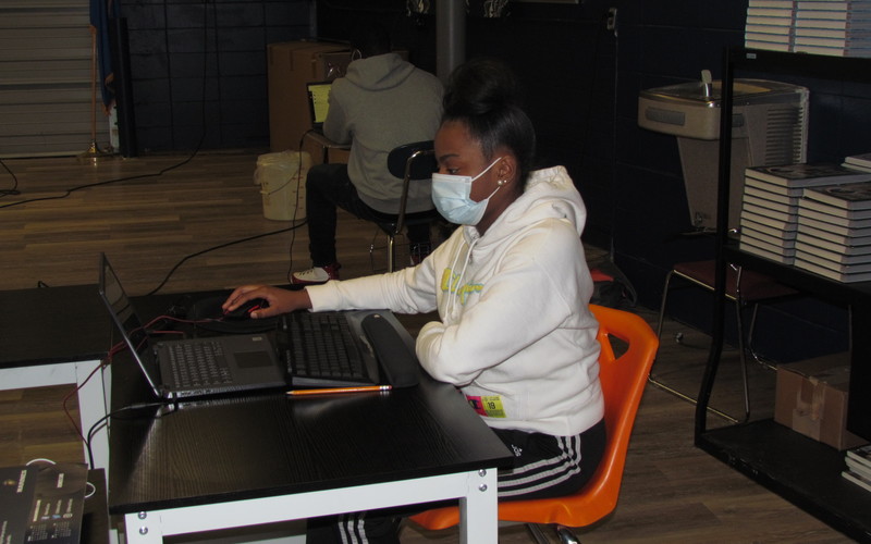 Cadet working at laptop