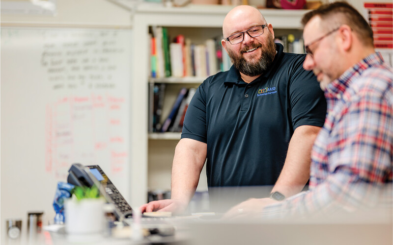 Scott Werfal walks his colleagues through cybersecurity training.