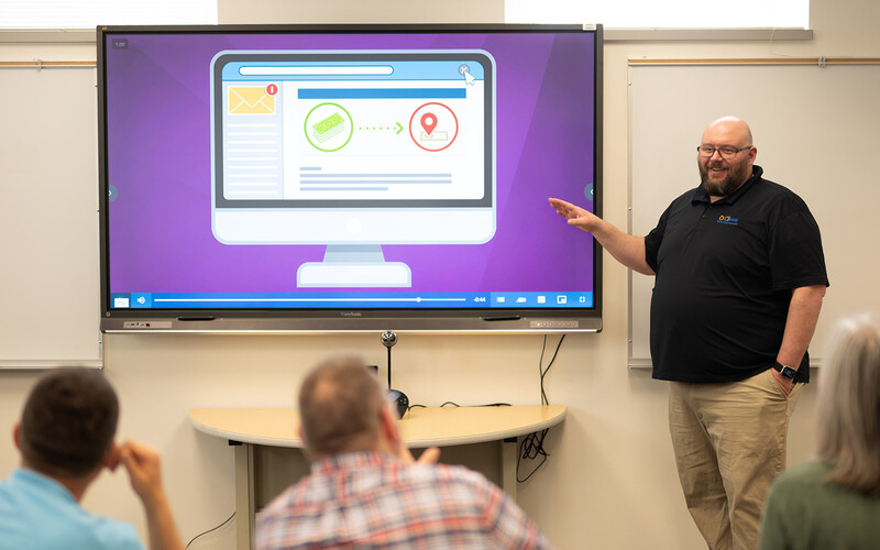 Scott Werfal walks his colleagues through cybersecurity training.