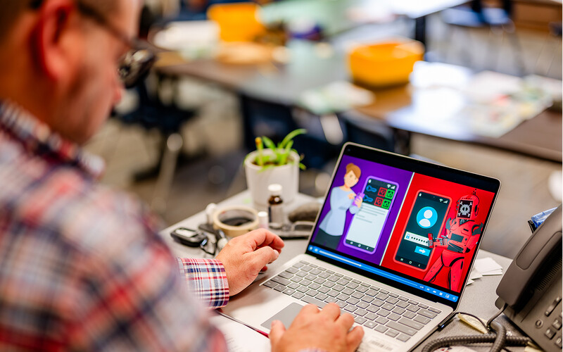 Scott Werfal walks his colleagues through cybersecurity training.