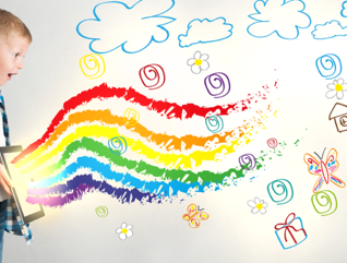 Kid uses ipad with rainbows coming out