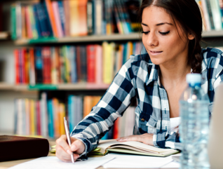 Student using laptop for taking notes to study