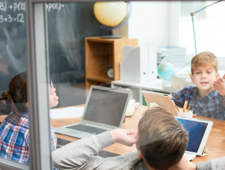 kids in school on tablets