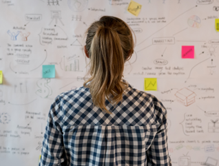 Woman looking at whiteboard