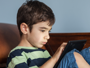 Kid on tablet
