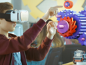 Student uses augmented reality platforms and vr education apps to learn coding.