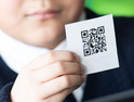 Kid with QR code card