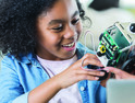 girl building robot