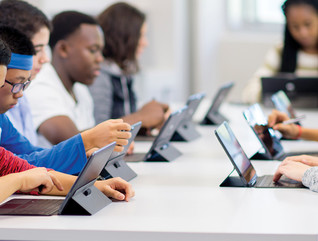 students using tablets in a classroom