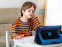 Boy using tablet for remote learning