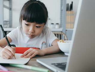 girl studying from home with laptop