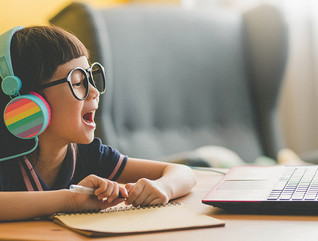 Girl using laptop for online learning