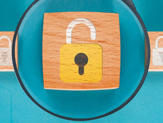5 blocks with lock illustration and magnifying glass over center block. 