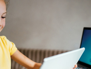 Girl on tablet and computer for e-learning