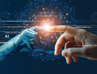 A robotic hand touching a human hand with a light where their fingers meet