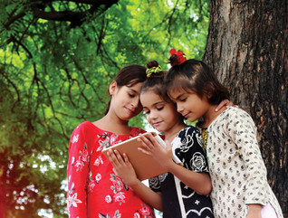 Students use a tablet for school in their community