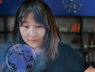 World language student uses technology to view a holographic projection of globe