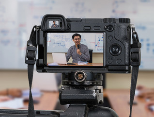 Teacher using AV camera in a classroom with students