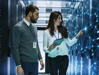 IT leader receives guidance in server room for network upgrades
