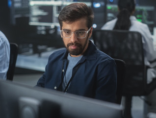 Team of programmers working in office