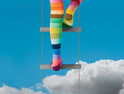 climbing into the cloud with rainbow socks on to represent elevated tech