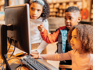Students using a computer in class