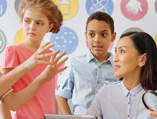 K-12 students learning STEM with teacher