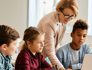 Teacher with students in classroom